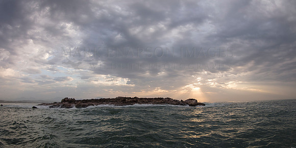 Dramatic skies over Seal Island, in Mossel Bay, South Africa