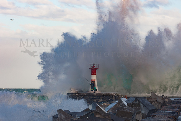 Fishermen brave a storm at Kalk Bay harbour, in False Bay, South Africa